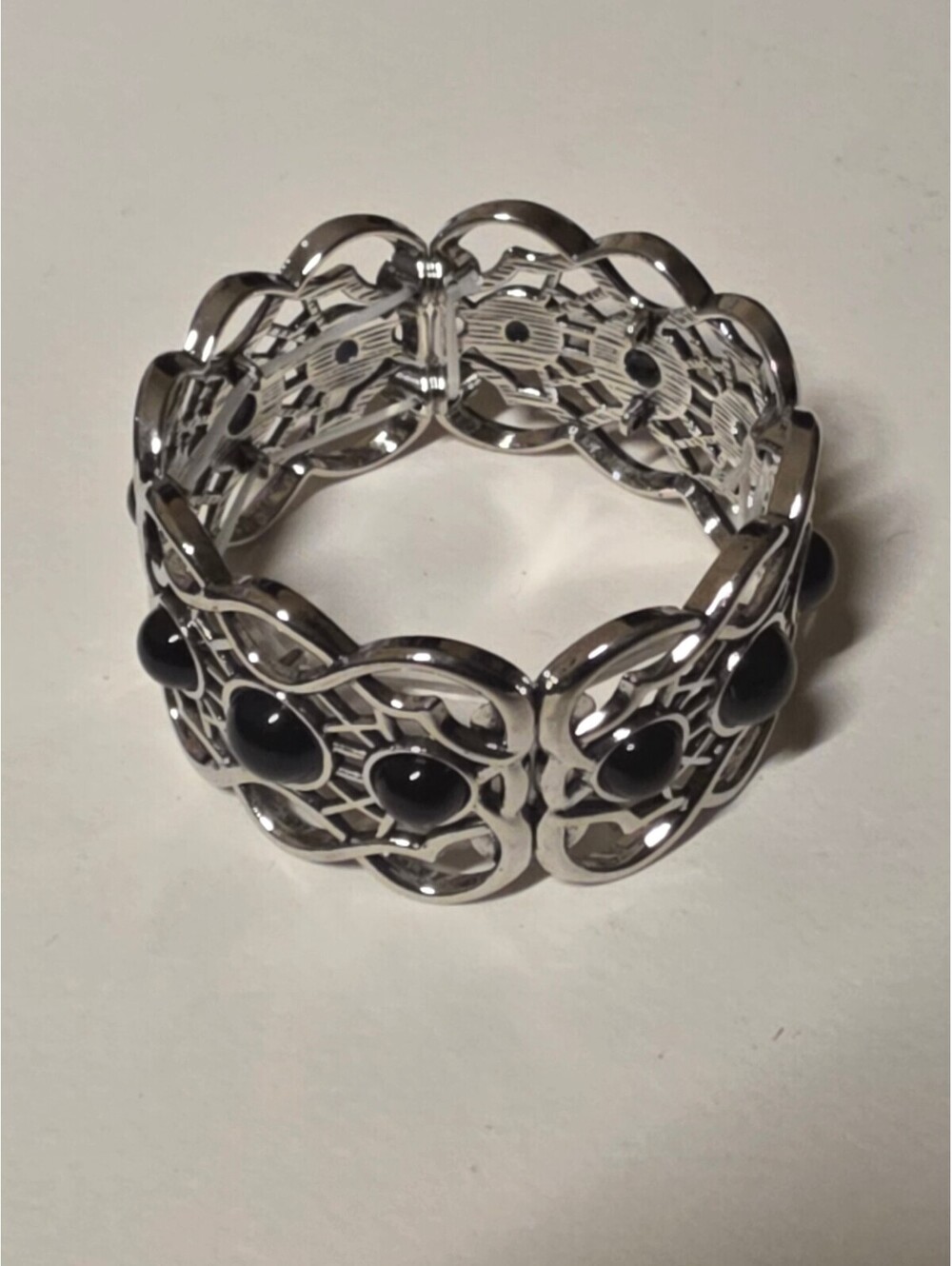 Silver Tone Floral Stretch Bracelet with Black Cabochons